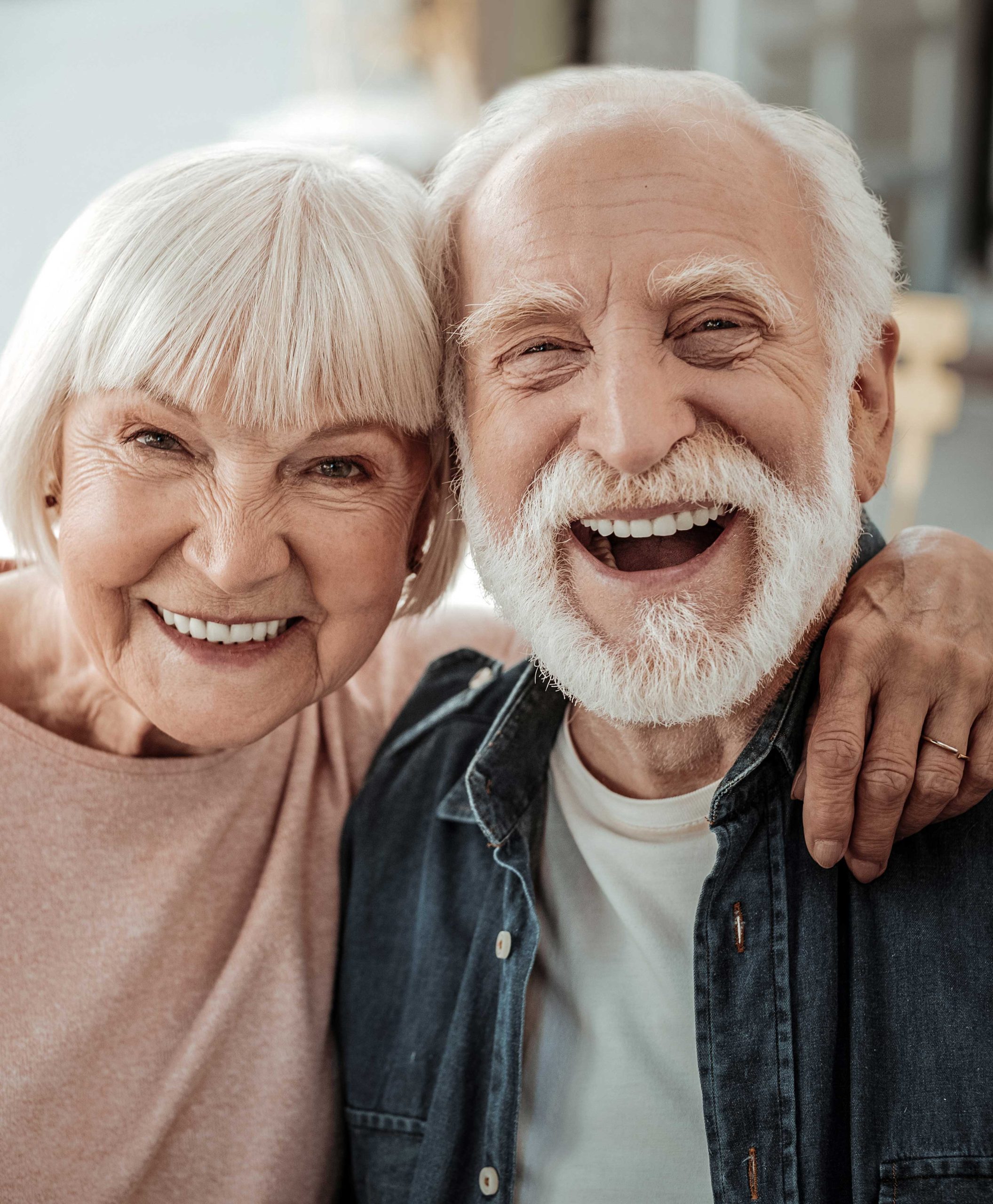 Cute and happy elderly senor couple smiling